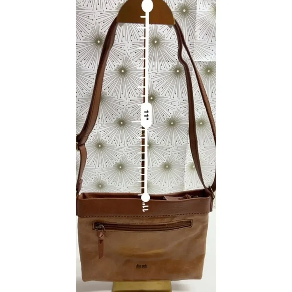 The Sak matte floral embossed tan leather Sanibel crossbody bag